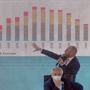 Argentine President Alberto Fernandez listens as the country’s finance minister explains the proposed payment to the International Monetary Fund (IMF) for the debt restructuring during a meeting with government officials and businessmen in Buenos Aires, Argentina, on Jan. 5, 2022. 