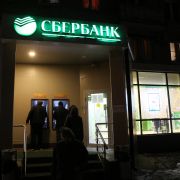 People in Moscow line up at ATMs outside a branch of the Russian state-owned Sberbank on Feb. 28, 2022. 