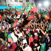Supporters of the ruling Pakistan Tehreek-e-Insaf (PTI) party take part in a rally in Karachi on April 1, 2022, after debate on a no-confidence motion against Pakistani Prime Minister Imran Khan was postponed. 