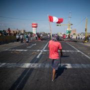 Demonstrators block a section of the Pan-American highway during a partial strike of cargo and passenger carriers in Ica, southern Peru, on April 4, 2022.