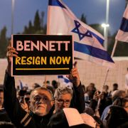 A man holds up a sign during an anti-government protest staged by Israeli right-wing supporters in Jerusalem, Israel, on April 6, 2022. 