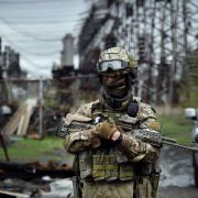 A Russian soldier stands guard at a power plant near Luhansk, eastern Ukraine, on April 13, 2022. 