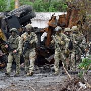 Russian servicemen patrol a destroyed part of Illich Steel and Iron Works in Ukraine's port city of Mariupol on May 18, 2022. Russian servicemen patrol a destroyed part of Illich Steel and Iron Works in Ukraine's port city of Mariupol on May 18, 2022.