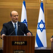 Israeli Prime Minister Naftali Bennett (left) and Foreign Minister Yair Lapid hold a joint press conference in Jerusalem on June 20, 2022, after agreeing to dissolve their fraught governing coalition. 