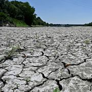 A photo taken on July 5, 2022, shows the dried-up river bed of the Po River in Italy's Veneto region. Water levels in Italy's largest river have reached record lows amid a severe drought. A photo taken on July 5, 2022, shows the dried-up river bed of the Po River in Italy's Veneto region. Water levels in Italy's largest river have reached record lows amid a severe drought.