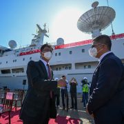 China's ambassador to Sri Lanka (left) gestures upon the arrival of China's research and survey vessel, the Yuan Wang 5, at the Hambantota port on Aug. 16, 2022. 