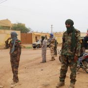 Fighters aligned with the National Movement for the Liberation of Azawad (MNLA) patrol a street in Kidal, northern Mali, on Aug. 28, 2022. 