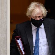 U.K. Prime Minister Boris Johnson leaves 10 Downing Street in London on Dec. 15, 2021, ahead of a Prime Minister's Questions (PMQ) session in parliament.