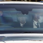 U.K. Prime Minister Boris Johnson (center) is seen in the backseat of a car in London, England, after holding a Prime Minister's Questions (PMQ) session in Parliament on Jan. 12, 2022. 