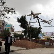 A photo taken in Sanaa, Yemen, on March 21, 2022, shows people walking under mock drones and missiles set up by supporters of the country's Iran-aligned Houthi movement, which earlier conducted attacks against Saudi energy facilities. A photo taken in Sanaa, Yemen, on March 21, 2022, shows people walking under mock drones and missiles set up by supporters of the country's Iran-aligned Houthi movement, which earlier conducted attacks against Saudi energy facilities.