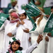 Fans of the Saudi national football team cheer during a match against Qatar at the King Fahad International Stadium in Riyadh, Saudi Arabia, on Nov. 26, 2014. Fans of the Saudi national football team cheer during a match against Qatar at the King Fahad International Stadium in Riyadh, Saudi Arabia, on Nov. 26, 2014.