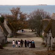 People visit the 1627 Pilgrim Village at "Plimoth Plantation," where role-players portray pilgrims seven years after the arrival of the Mayflower, in Plymouth, Massachusetts.