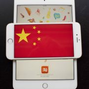 The Chinese flag is seen on a display of an iPhone in Hong Kong.