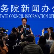 Zhang Xiaoming (C), Executive Deputy Director of the Hong Kong and Macao Affairs Office of the State Council, at the end of a State Council press conference on Hong Kong electoral reform March 12, 2021, in Beijing.