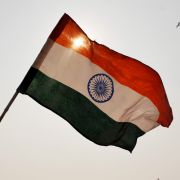 India’s national flag waves above a rally in New Delhi. 