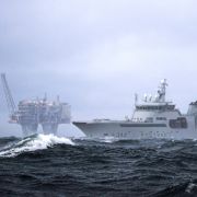 A Norweigan coast guard ship patrols the waters surrounding an  offshore gas platform in the Troll gas field off the west coast of Norway.