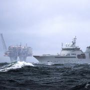 A Norweigan coast guard ship patrols the waters surrounding an offshore gas platform in the Troll gas field off the west coast of Norway. A Norweigan coast guard ship patrols the waters surrounding an offshore gas platform in the Troll gas field off the west coast of Norway.