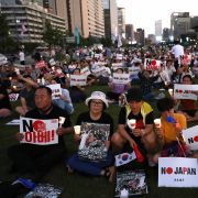 South Koreans participate in a rally to denounce Japan's new trade restrictions and Japanese Prime Minister Shinzo Abe on Aug. 24, 2019, in Seoul. The bilateral relationship between Japan and South Korea has worsened recently amid escalating trade tensions. 