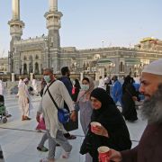 Muslim pilgrims wear masks at the Grand Mosque in Saudi Arabia's holy city of Mecca on Feb. 28, 2020. Muslim pilgrims wear masks at the Grand Mosque in Saudi Arabia's holy city of Mecca on Feb. 28, 2020.