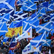 Protesters with Scottish Saltire flags attend a march calling for Scottish independence in Glasgow on Jan. 11, 2020. 