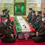 Members of Iranian forces pray around the coffin of slain nuclear scientist Mohsen Fakhrizadeh during his burial ceremony at Imamzadeh Saleh shrine in northern Tehran on Nov. 30, 2020.