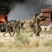 Turkey-backed Syrian fighters conduct military exercises in Syria's northern city of Manbij on June 2.