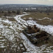 A destroyed tank sits atop a hillside on Feb. 11, 2023, in Kamyanka, Ukraine.
