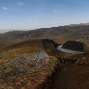 A picture taken on Aug. 16, 2021, shows the landscape of Iran behind a section of the newly completed wall on Turkey’s eastern border in Caldiran. A picture taken on Aug. 16, 2021, shows the landscape of Iran behind a section of the newly completed wall on Turkey’s eastern border in Caldiran.