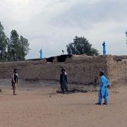Taliban members stand near the birth house of the group’s supreme leader, Hibatullah Akhunzada, in Kandahar, Afghanistan, Nov. 7, 2021. Taliban members stand near the birth house of the group’s supreme leader, Hibatullah Akhunzada, in Kandahar, Afghanistan, Nov. 7, 2021.