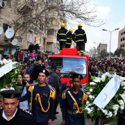 Policemen carry wreaths in Cairo on Feb. 19, 2019, at the funeral of Mahmud Abu el-Yzied, one of three policemen killed in a bombing the previous day.