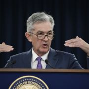 This image shows Jerome Powell, chairman of the U.S. Federal Reserve, delivering news about the central bank's decision to cut its benchmark interest rate.