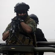 Soldiers stand guard as an alleged Gulf Cartel leader is presented to the media May 25, 2014, at the hangar of the Attorney General's office at Benito Juarez International Airport in Mexico City. The arrest of Evaristo Cruz Sanchez, aka "El Vaquero," could increase violence in northeastern Mexico as other cartels capitalize on the opportunity to seize turf. Soldiers stand guard as an alleged leader of the Gulf Cartel is presented to the media May 25, 2014, at the hangar of the Attorney General's office at Benito Juarez International Airport in Mexico City.