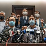 Pro-democracy lawmakers join hands during a press conference at Hong Kong’s Legislative Council after city officials ousted four of their colleagues on Nov. 11, 2020 Pro-democracy lawmakers join hands during a press conference at Hong Kong’s Legislative Council after city officials ousted four of their colleagues on Nov. 11, 2020