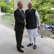 Russian President Vladimir Putin (left) welcomes Indian Prime Minister Narendra Modi during a meeting in Sochi on May 21.