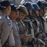 The old Stratfor mobile application retires today. Stay up-to-date on the latest developments with the new Stratfor mobile app, with enhanced features and usability. An Indonesian policeman (5th L) checks his mobile phone while standing in line during a security roll call in Banda Aceh on April 11, ahead of the country's general elections.