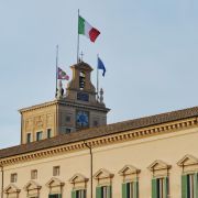 A photo taken on Feb. 3, 2022, shows flags raised outside the Quirinale in Rome, Italy, for the arrival of newly re-elected Italian President Sergio Mattarella.