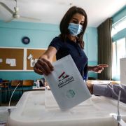 A voter casts her ballot in Lebanon's May 15, 2022, parliamentary election at a polling station in the southern suburbs of Beirut.