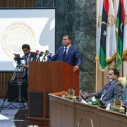 Libyan Prime Minister-designate Abdul Hamid Dbeibah addresses lawmakers during the first reunited parliamentarian session on March 9, 2021, in the coastal city of Sirte, east of the Libyan capital of Tripoli.