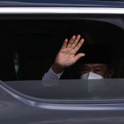 Malaysian Prime Minister Muhyiddin Yassin waves as he arrives at the national palace in Kuala Lumpur on Aug. 16, 2021. 