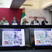 Images of the place where four U.S. citizens were found after being kidnapped in Matamoros, Mexico, are shown on screens during a press conference in Mexico City on March 7, 2023. 