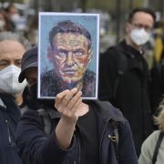 A demonstrator displays a portrait of Russian opposition leader Alexei Navalny during a protest in Berlin, Germany, on April 21, 2021. A demonstrator displays a portrait of Russian opposition leader Alexei Navalny during a protest in Berlin, Germany, on April 21, 2021.