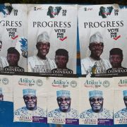 Side-by-side campaign posters line a bus stop for President Muhammad Buhari and his challenger, Atiku Abubakar, ahead of the presidential election on Feb. 16. 