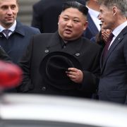 North Korean leader Kim Jong Un (2R) listens to Primorsky Gov. Oleg Kozhemyako (R) upon arrival at the railway station in Vladivostok on April 24, 2019. 