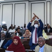 A member of parliament gestures in response to the president’s request to annul a law extending his term in Mogadishu, Somalia, on May 1, 2021. A member of parliament gestures in response to the president’s request to annul a law extending his term in Mogadishu, Somalia, on May 1, 2021.