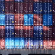 A stack of shipping containers at a port