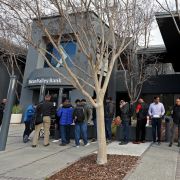 People seeking to retrieve their funds from the failed Silicon Valley Bank line up outside of the bank's offices in Santa Clara, California, on March 13, 2023.