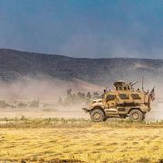 A U.S. Oshkosh M-ATV Mine Resistant Ambush Protected military vehicle patrols near the Syria-Turkey border in a village east of Qamishli in Syria's northeastern Hasakah province on Aug. 21. The village was subject to bombardment the previous week.