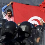 Police block protesters from accessing the parliament building on Jan. 26, 2021, in Tunis, Tunisia. Police block protesters from accessing the parliament building on Jan. 26, 2021, in Tunis, Tunisia.