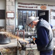 A blacksmith crafts metal in a village mansion in Ankara, Turkey, on Nov. 18, 2020. 