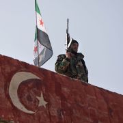 A Turkish-backed fighter guards the rebel-held province of Aleppo in northern Syria on Nov. 17, 2020. A Turkish-backed fighter guards the rebel-held province of Aleppo in northern Syria on Nov. 17, 2020.